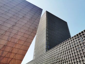 Low angle view of modern buildings against clear sky