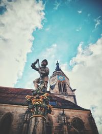 Low angle view of statue against sky