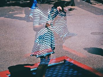 Double exposure image of girl jumping on trampoline