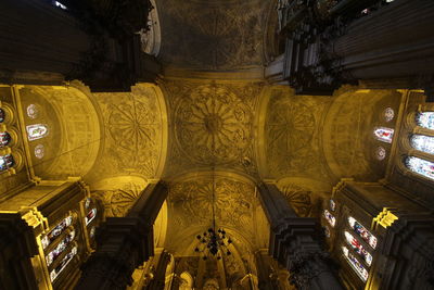 Low angle view of illuminated ceiling of building