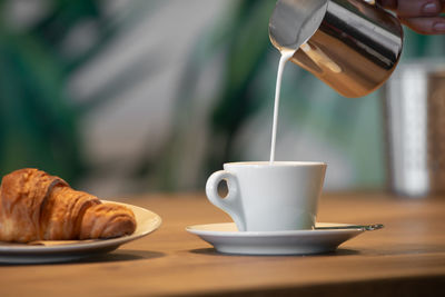 Close-up of coffee cup on table