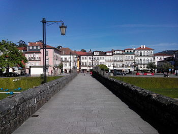 Old footbridge against buildings