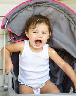 Portrait of cute girl in stroller