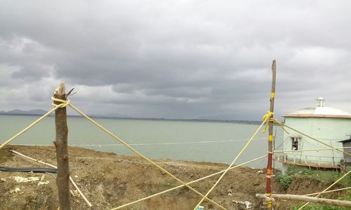 Scenic view of sea against cloudy sky