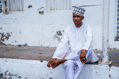 Young man sitting outdoors