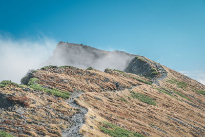 Scenic view of landscape against clear blue sky