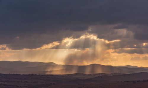 Scenic view of mountains against sky during sunset