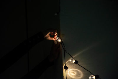 Low angle view of illuminated light bulb