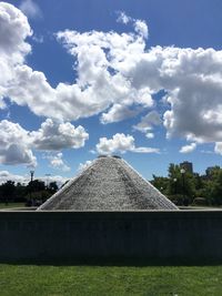 Scenic view of building against cloudy sky