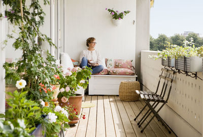 Woman relaxing on balcony