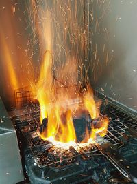 Close-up of fire on barbecue grill