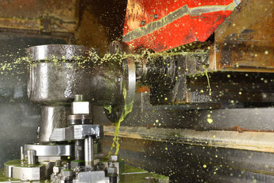 Close-up of water drops on machine