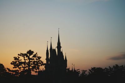 Silhouette of building at sunset