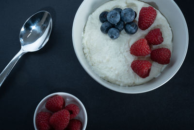 High angle view of strawberries in bowl on table