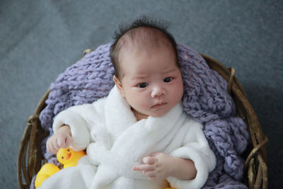 Portrait of cute baby boy with toy