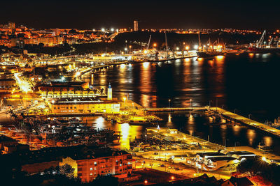 High angle view of illuminated buildings in city at night