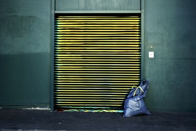 Yellow closed door of shutter