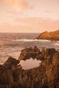 Scenic view of sea against sky during sunset