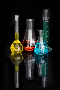 Test tubes and beakers with colorful liquids in laboratory