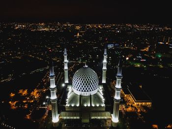 Illuminated buildings in city at night