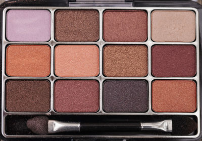 Close-up of make-up brush with palette