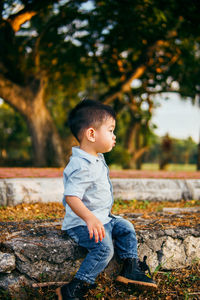 Side view of boy looking away outdoors
