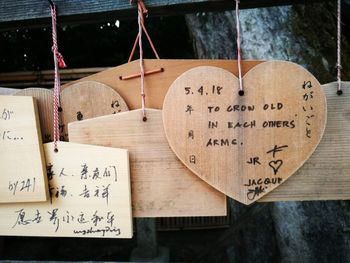 Close-up of text on wooden table