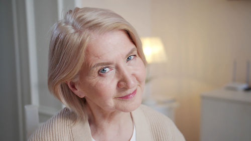 Close-up of young woman at home