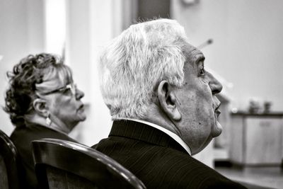 Portrait of couple sitting outdoors