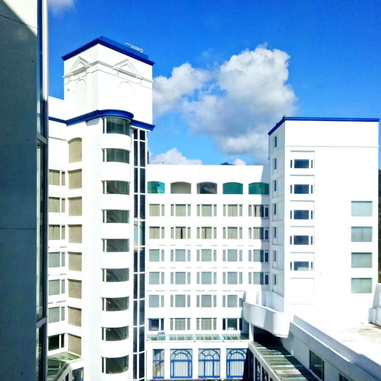 building exterior, architecture, built structure, sky, city, window, day, low angle view, no people, skyscraper, outdoors, cloud - sky, residential building, modern, building story, townhouse, office block