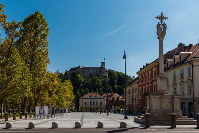 View of street amidst buildings in city