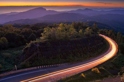 High angle view of light trails on road in city