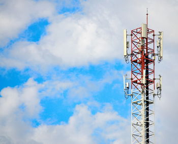 Low angle view of communications tower against sky