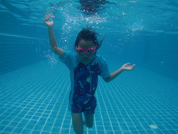 Girl swimming in pool