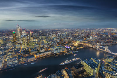 High angle view of illuminated bridge and buildings against sky