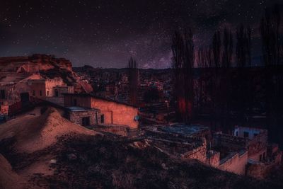 Buildings against sky at night