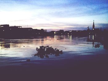 Reflection of clouds in water at sunset