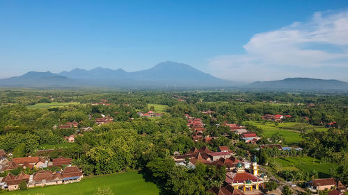 High angle view of trees and houses against sky