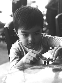 Portrait of cute boy playing outdoors