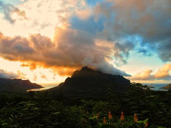 Scenic view of mountains against dramatic sky