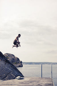 Man jumping into water