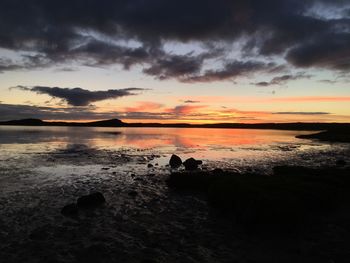 Scenic view of sea against dramatic sky