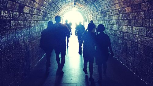 Woman walking in tunnel