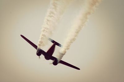 Low angle view of airplane flying in sky