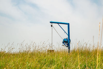 Man standing on field against sky