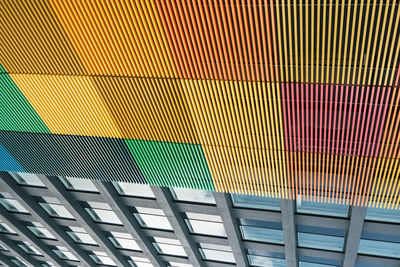 Full frame shot of multi colored aluminum strips on building