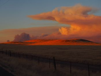 Scenic view of sea against orange sky