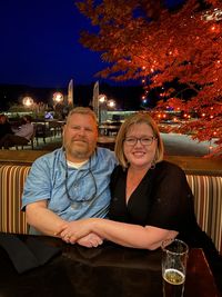 Portrait of mature couple sitting at restaurant