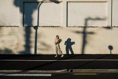 Men walking on zebra crossing