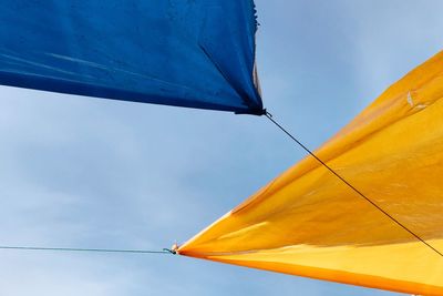 Low angle view of parasol against sky
